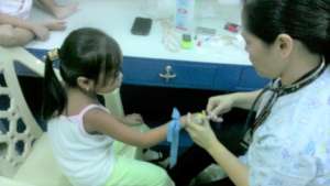 Helping a child with her treatment