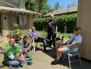 Board members Bob T and Bob V chat with residents