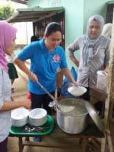 Teachers serving meals to children
