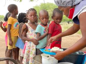 Students being served lunch in Duvane School