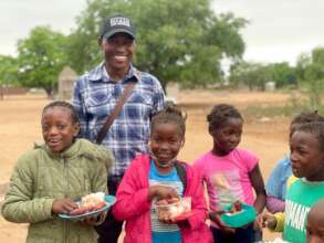 Roberto, our Programs Manager, with students