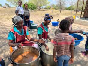 Cooks serving lunch at Cumba Primary School