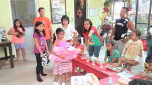 Children exchange Christmas gifts