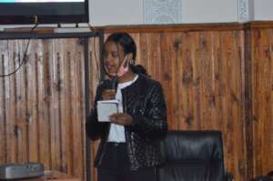 Yasmine speaking at a community dialogue
