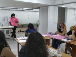 Andressa briefs the class on child protection