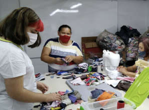 Students sort offcuts to help make masks for ACER