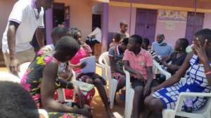 Youth leader reading a list of summarized needs
