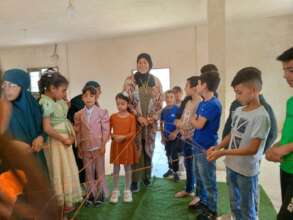 Fatma with a group of children