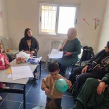 Fatma talking to mothers