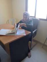 Fatma at work in her office