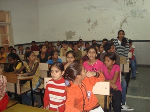 A girl sharing her views with the group.