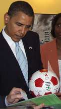 Barack Obama inspecting an Alive & Kicking ball