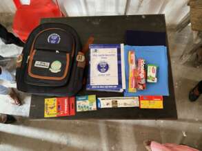 Providing school supplies at Sanischare Sec School