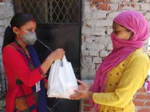 RISE team distributing ration kits