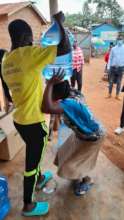 Helping a woman get water to her head