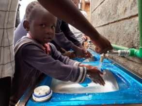 children washing their hand before taking a meal