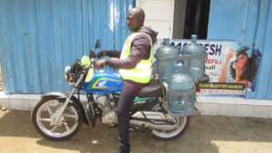 newly acquired motorbike for water delivery.