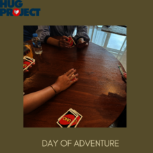 Our social workers play cards with child survivor