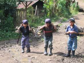 Young boys carrying firewood in Chajul