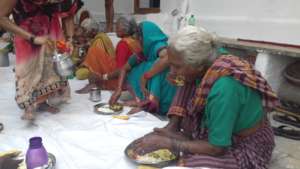 Deprived Old age women having nutritious meals