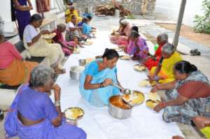 Elderly Persons having midday meals center