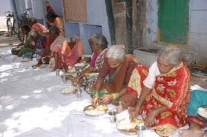 Elderly persons having meal together donate today