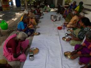 Poor Old age women having food at oldagecare india