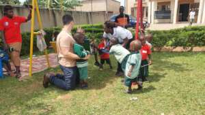 children and adults in play time