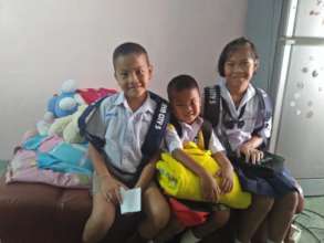 Children of family celebrate first day of school