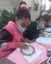 Coloring Mandala Art in Artist Laila's class