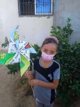 Art student holding her Pinwheel for Peace