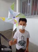 A child holding a pinwheel