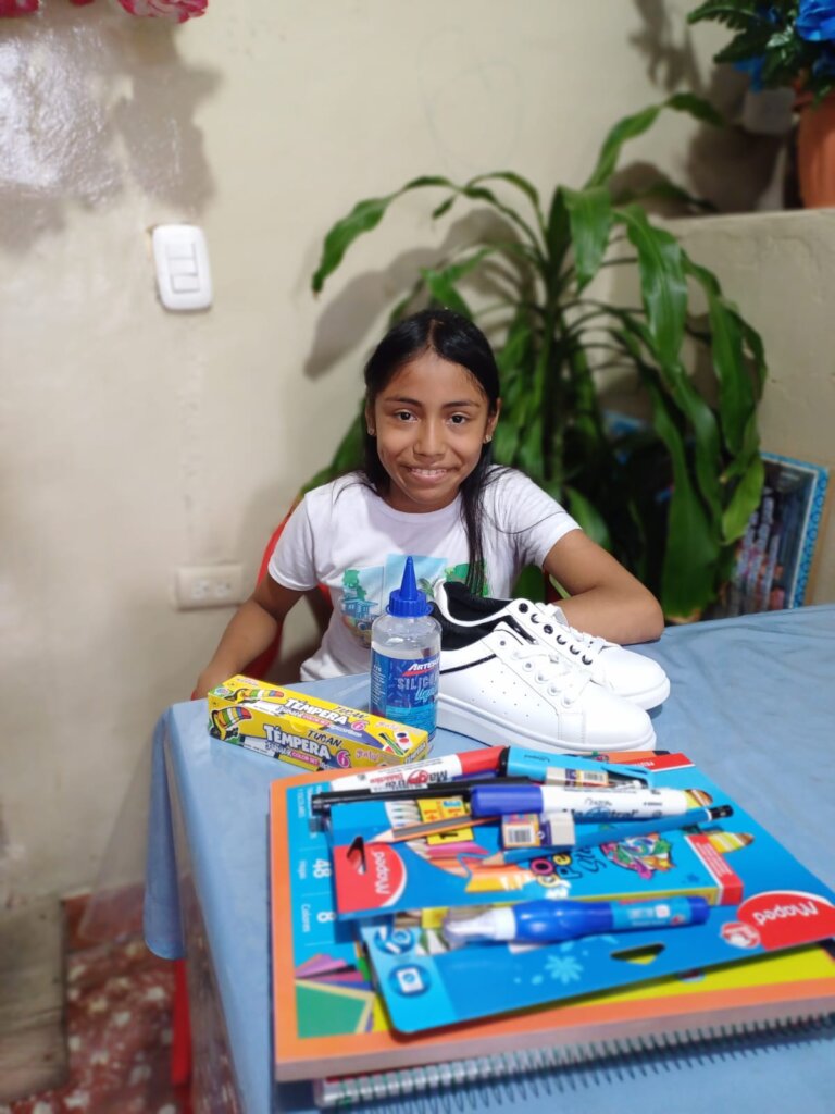 7th grader receiving school supplies