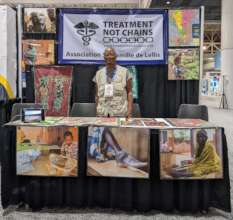 Gregoire greets participants at the exhibit booth.