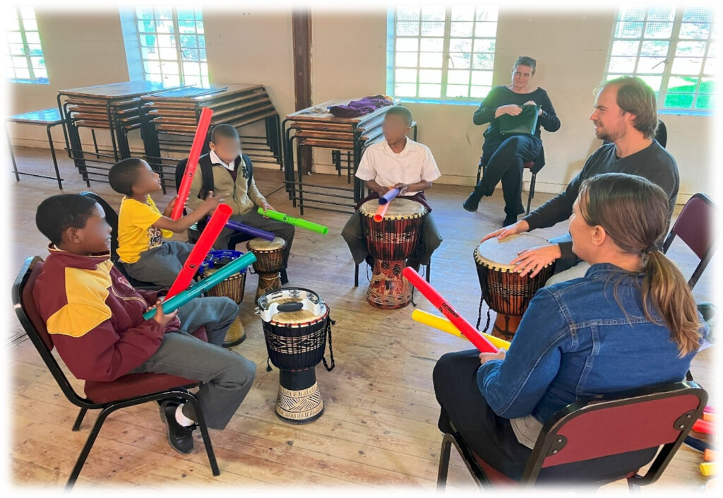 Learners engaging in a percussion lesson