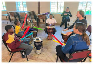 Learners engaging in a percussion lesson