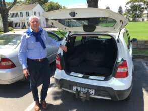 Mr Mitchell(Diocesan College) with donated guitars