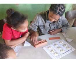 practicing maths skills using dominoes