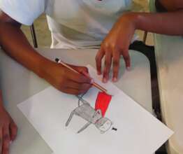 child drawing superhero honey badger