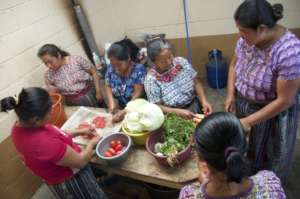 Preparing a healthy meal under Sandy's instruction