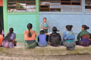 Participants listen to Sandy's presentation