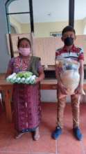 Sponsored student receiving monthly food basket