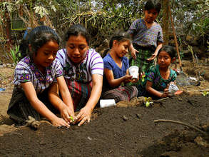 Our garden technician working with students