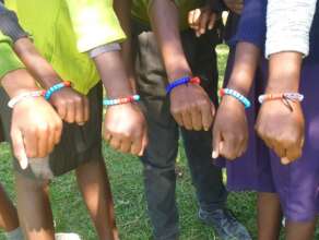 Students wearing Global Symbol for Menstruation