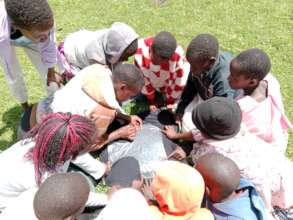 Youth making sanitary towels during SRHR training