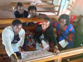 Women learning about reproductive system