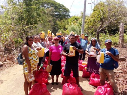 Families receiving their food package