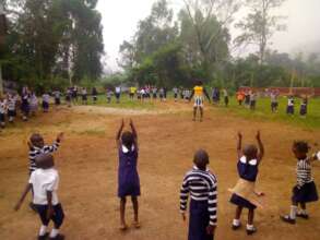 Young Children Learning In The Open Air