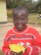 A boy at SITL enjoying some of his free lunch!