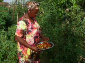 A beneficiary of RUWAI STW, 2020, harvesting veg.